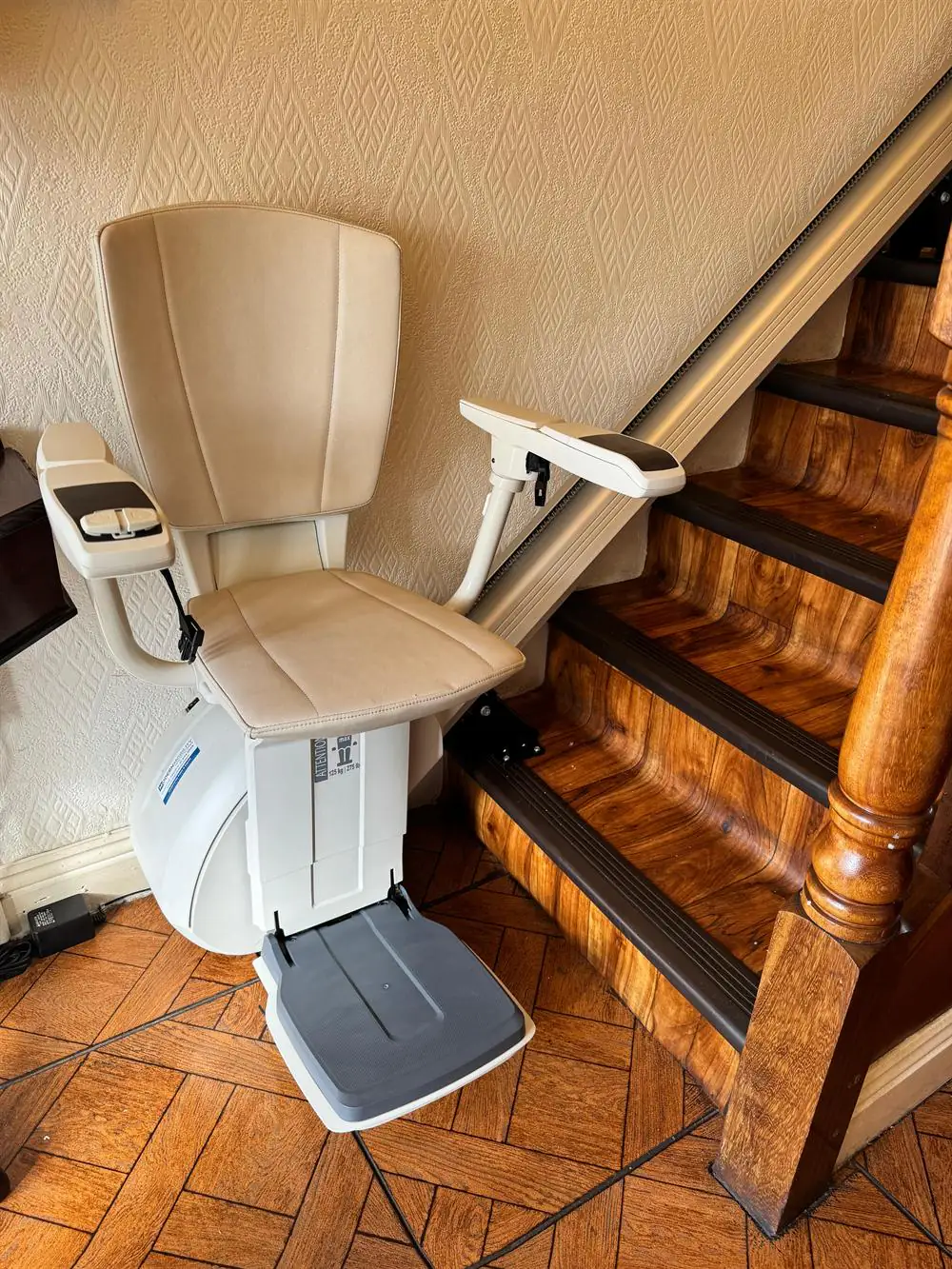 Cream straight stairlift fitted beside a polished timber staircase in Wicklow