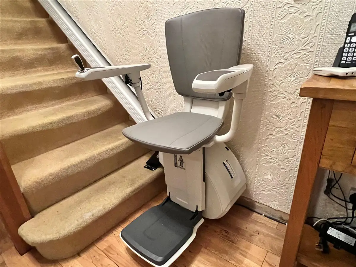 Reconditioned straight stairlift installed neatly in a family home