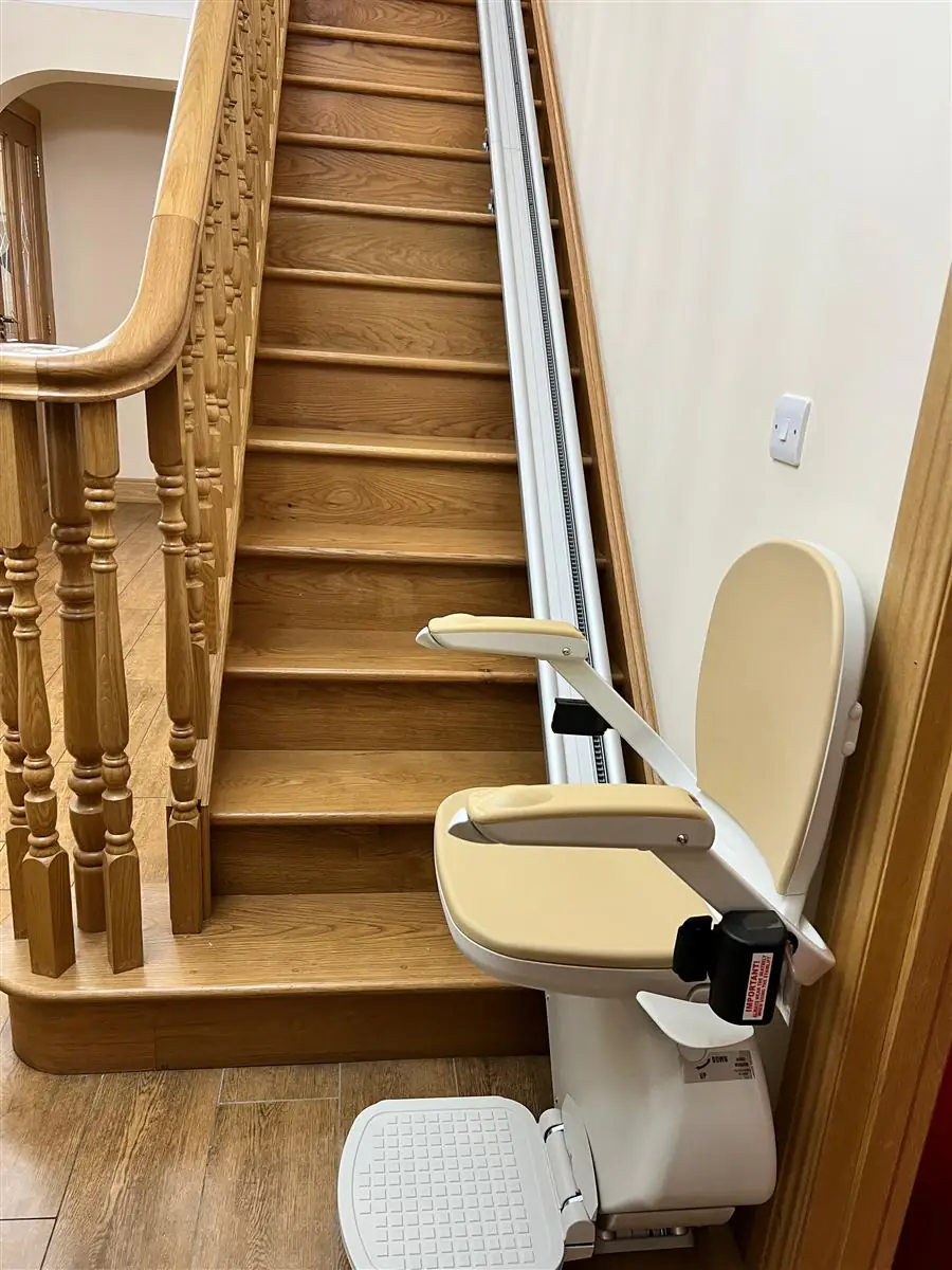 Freshly fitted straight stairlift on a timber staircase