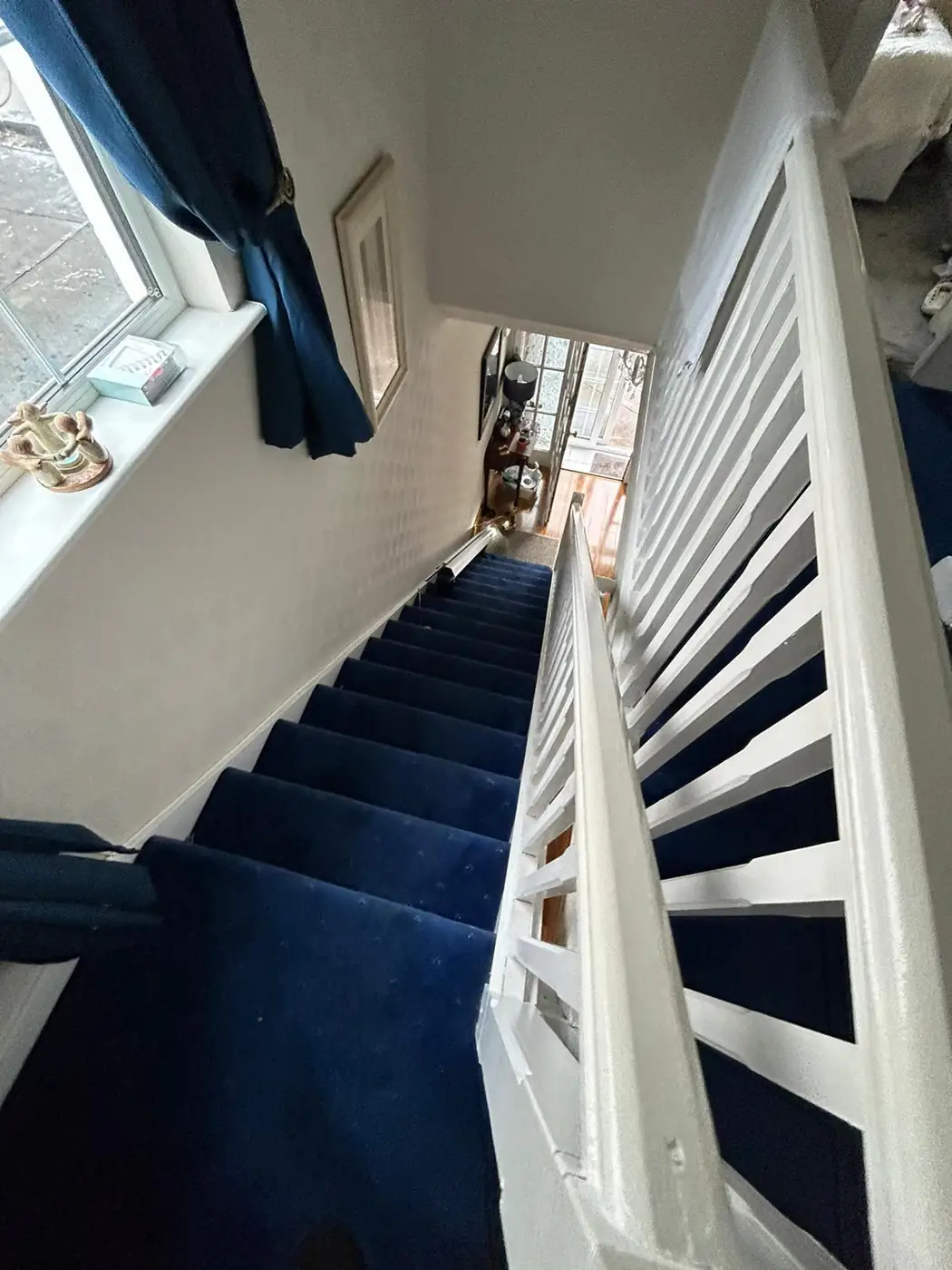 Folded rental stairlift leaving the hallway clear