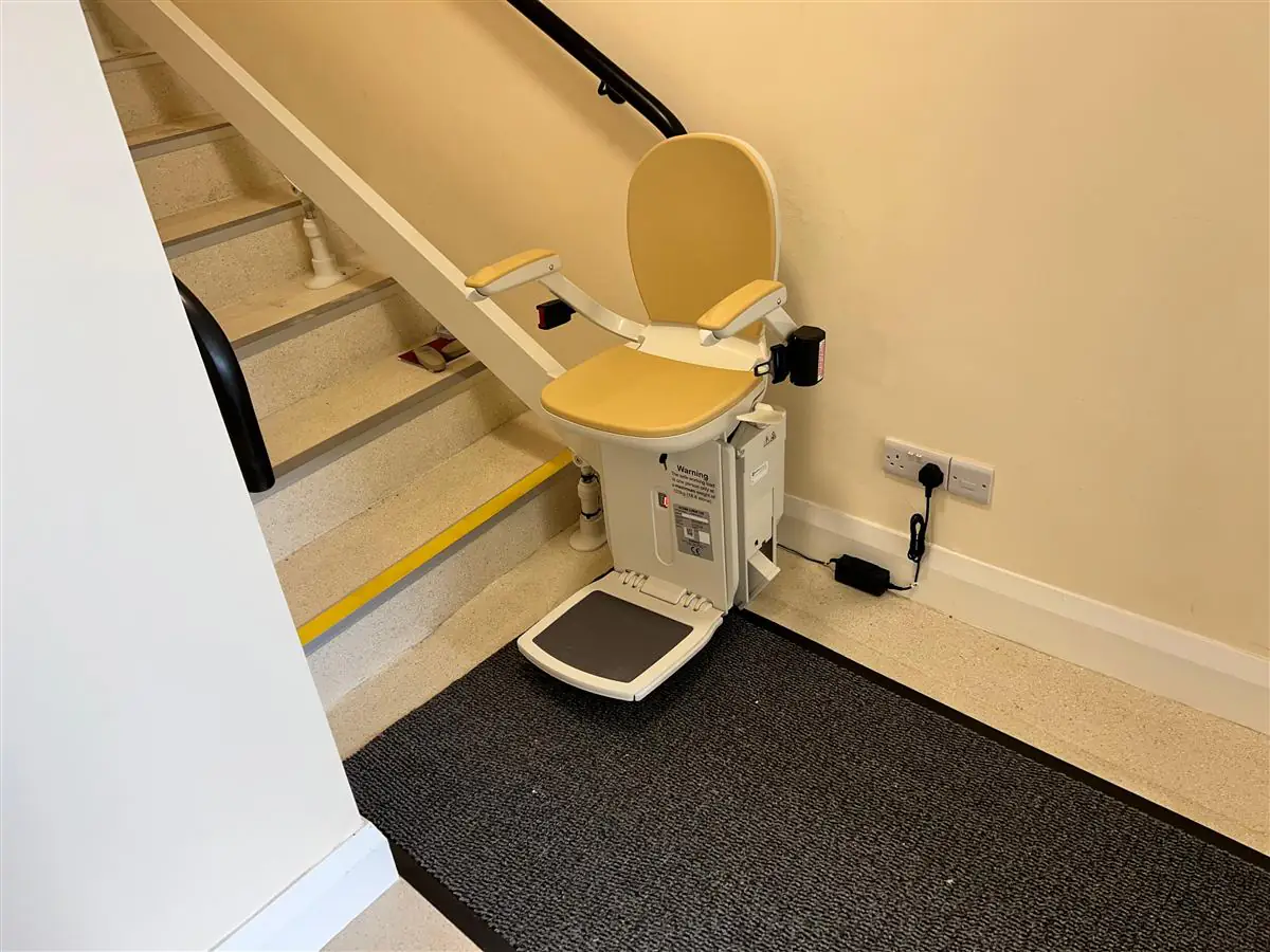 Straight stairlift fitted neatly beside a staircase in an Irish home