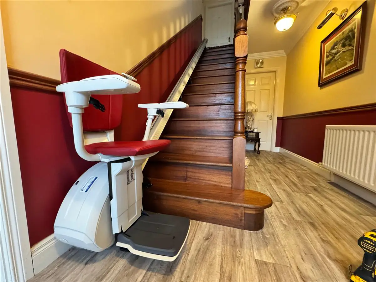 Thyssen HomeGlide straight stairlift installed beside a timber staircase